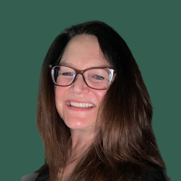 Portrait of Karen Thesing looking at the camera and smiling